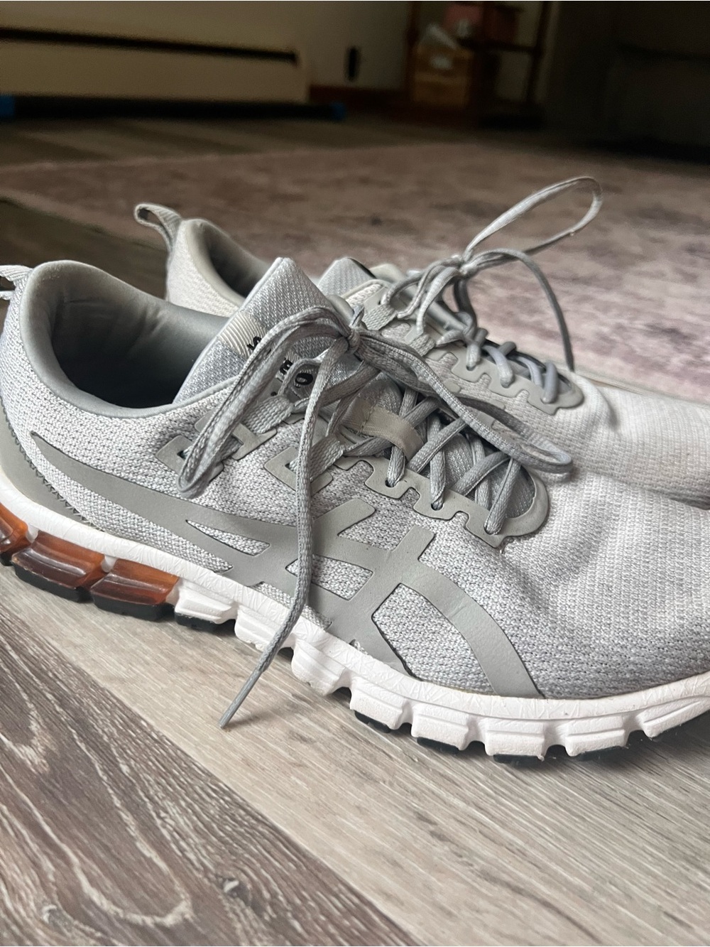 Asics Light Gray Athletic Running Shoes with Subtle Amber Accents